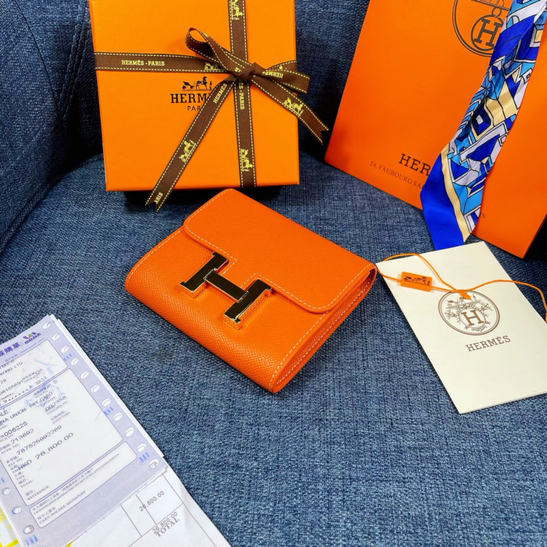 HM CONSTANCE 12 ORANGE CALFSKIN GOLD HARDWARE