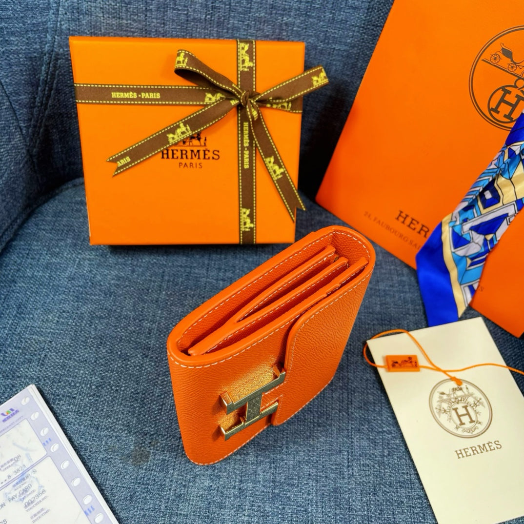 HM CONSTANCE 12 ORANGE CALFSKIN GOLD HARDWARE