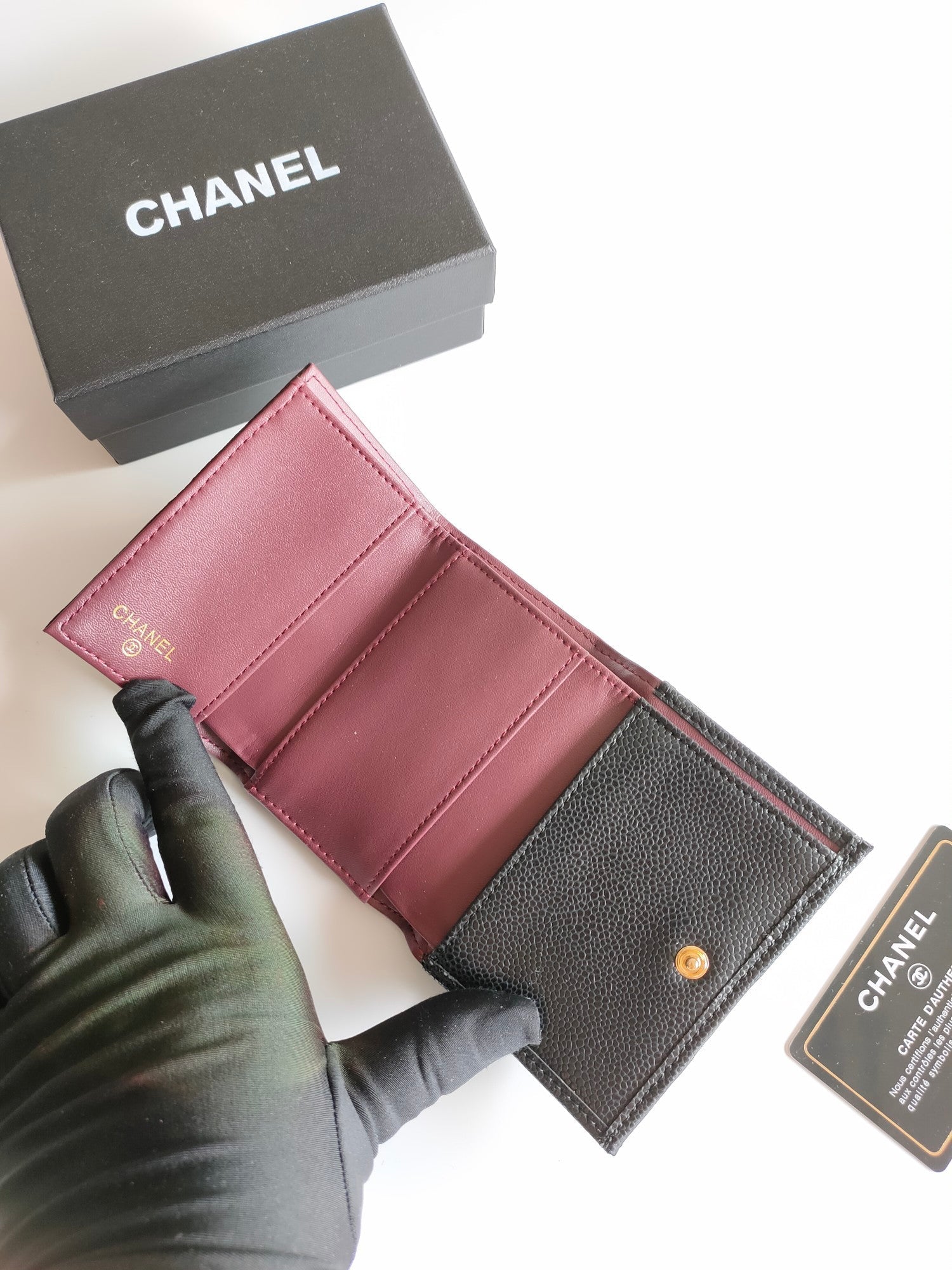 CC TRIFOLD PURSE 12 BLACK GRAINED CALFSKIN GOLD ICON