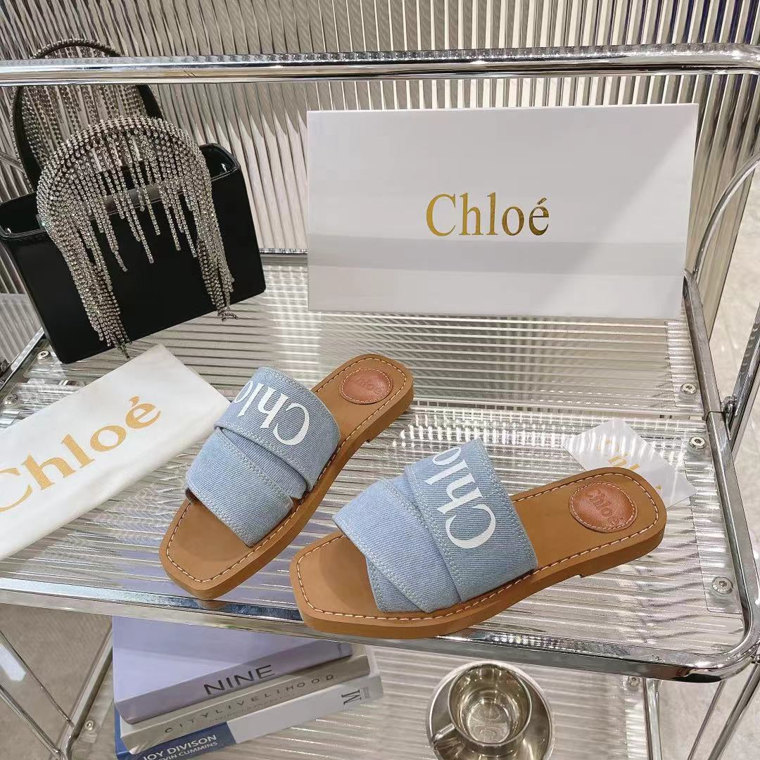 CHLOE WOODY MULE IN LIGHT BLUE DENIM WITH WHITE LOGO