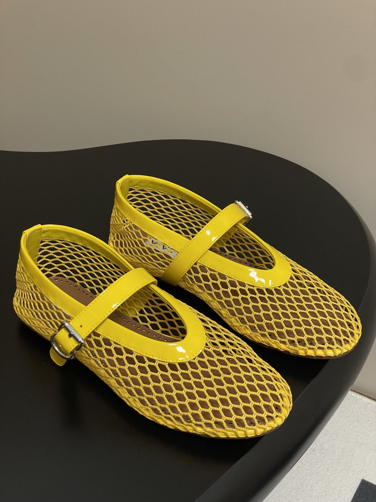 ALAIA BALLET FLATS IN YELLOW MESH FISHNET