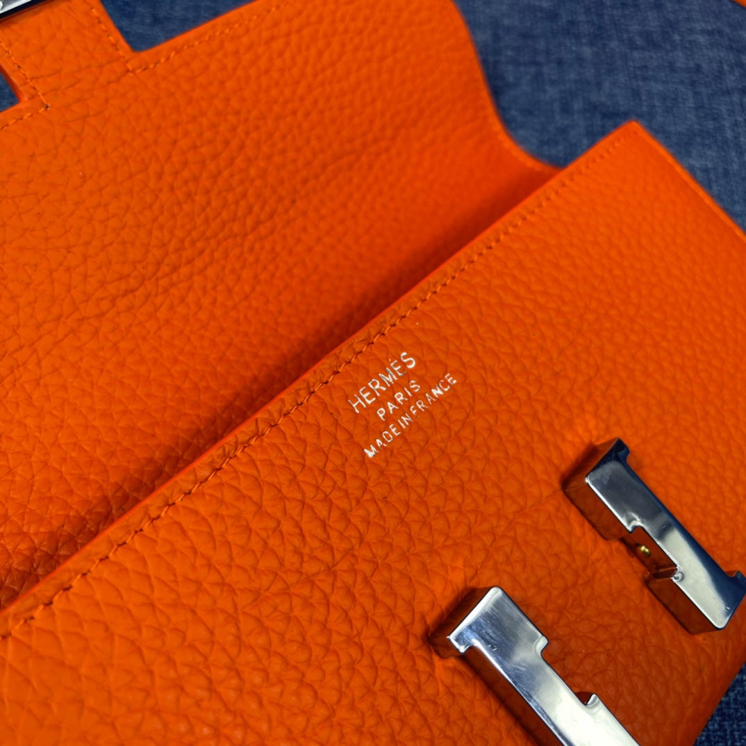HM CLUTCH CONSTANCE 22 ORANGE CALFSKIN SILVER HARDWARE