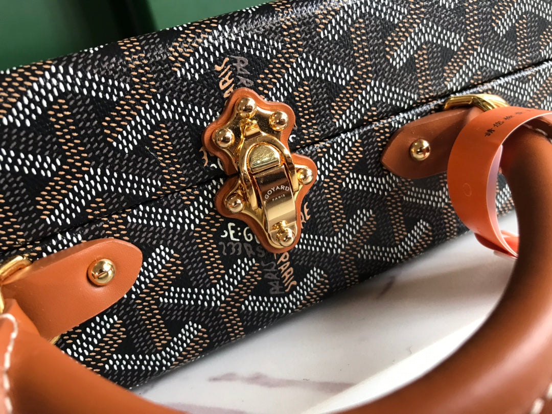 GRAND HÃ”TEL TRUNK BAG 24 IN BLACK GOYARDINE CANVAS AND TAN CALFSKIN