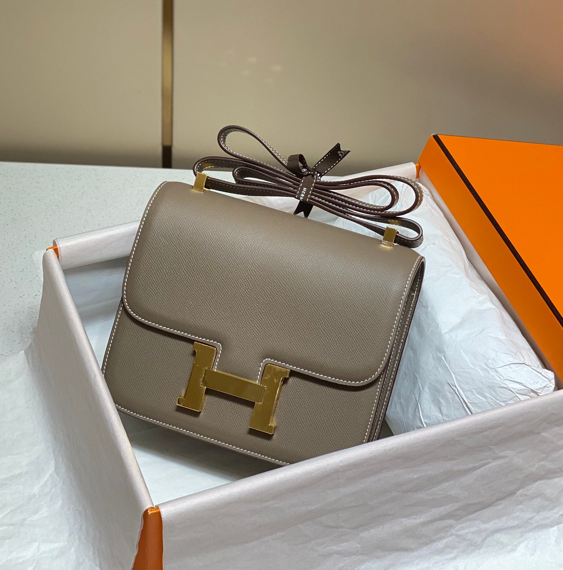 constance 24 etoupe epsom leather gold hardware