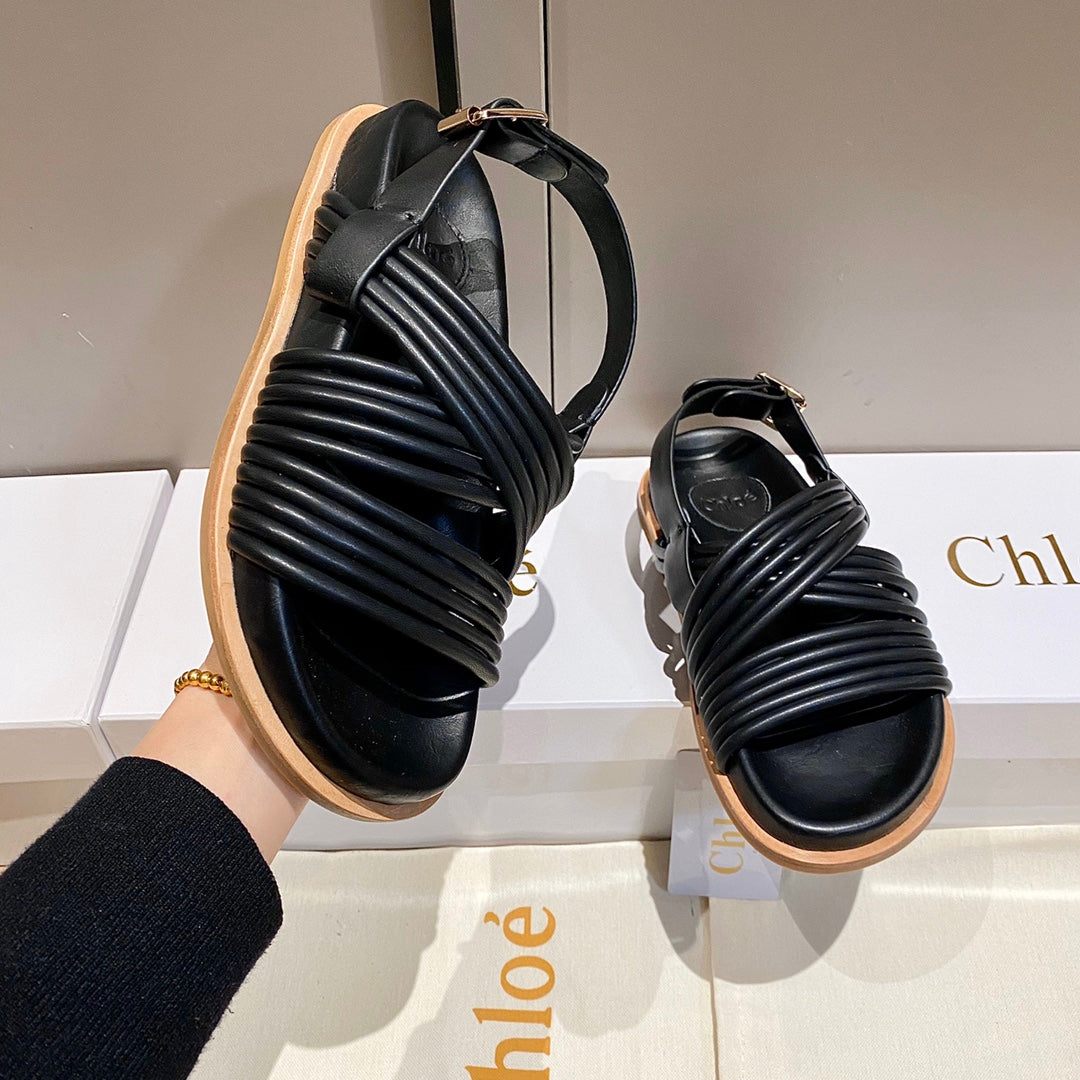 CHLOE CROSS STRAP SANDAL IN BLACK RUBBER WITH GOLD HARDWARE