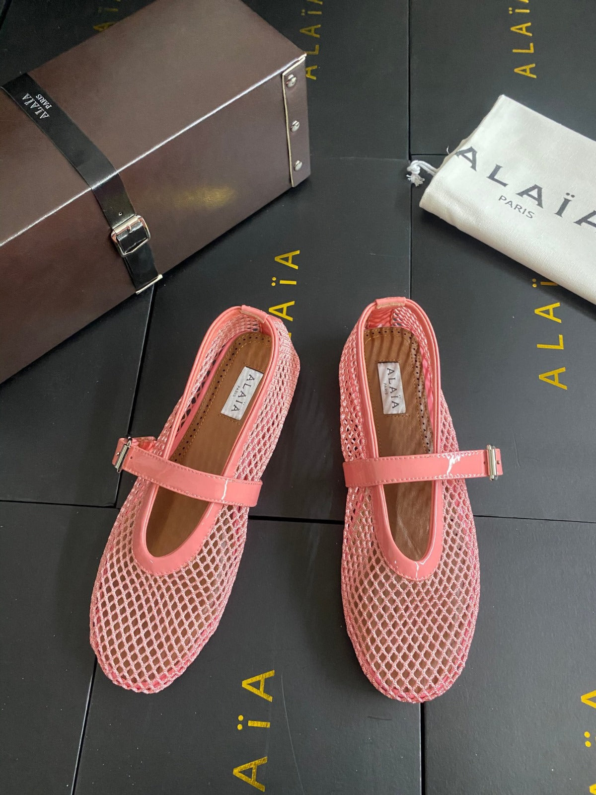 ALAIA BALLET FLATS IN LIGHT PINK MESH FISHNET