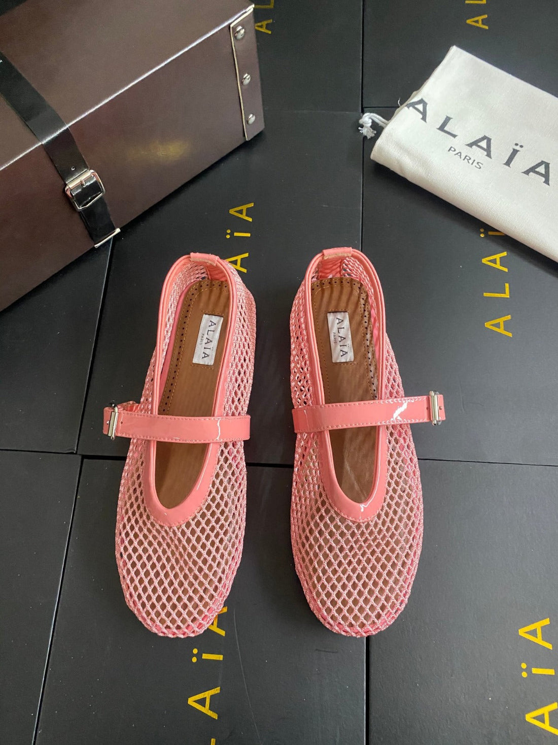 ALAIA BALLET FLATS IN LIGHT PINK MESH FISHNET