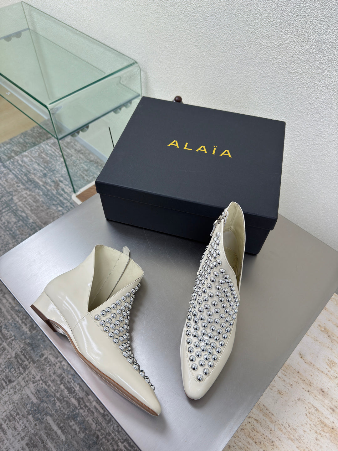 ALAIA Rivet ankle boots ivory cowhide leather 471092