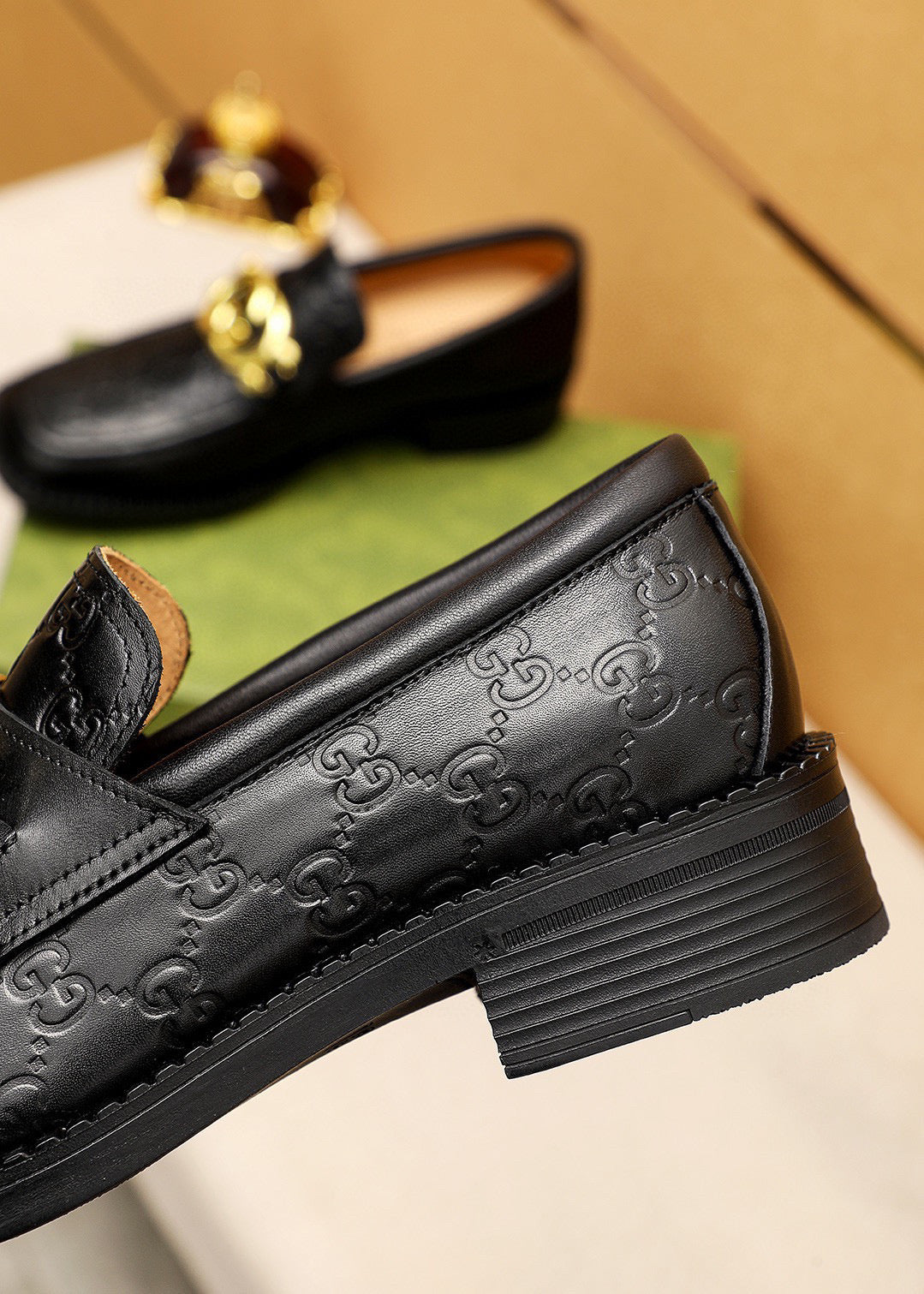 GG Men's Loafer Black GG Gold Embossed Cowhide 736976