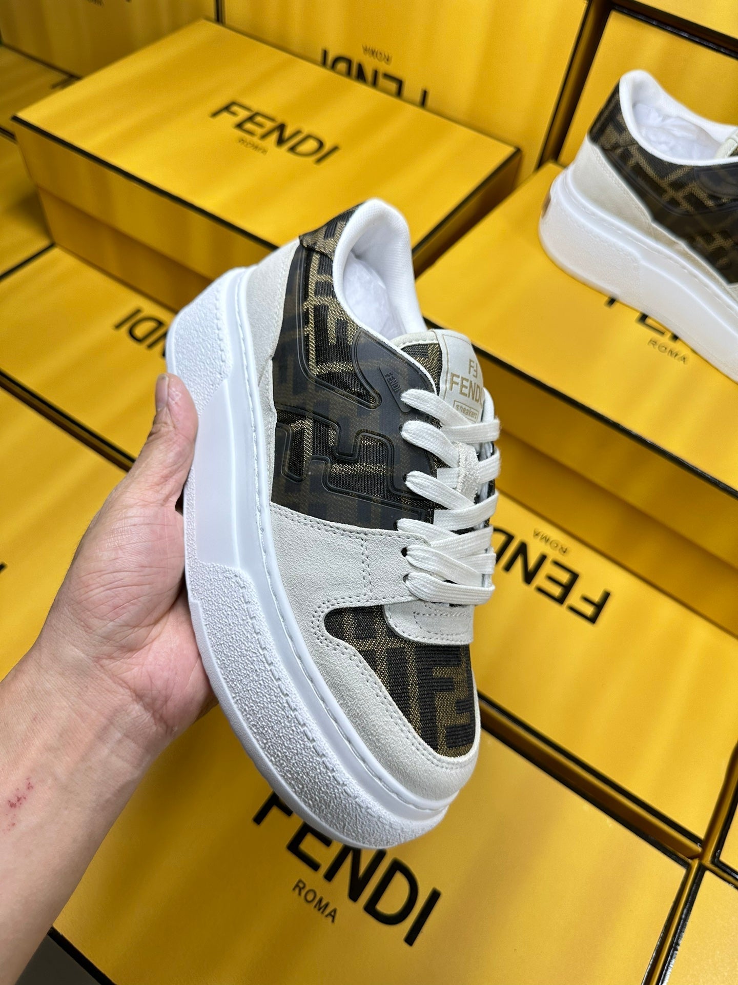 FENDI THICK-SOLDED SNEAKER IN WHITE SUEDE AND BROWN MONOGRAM FABRIC