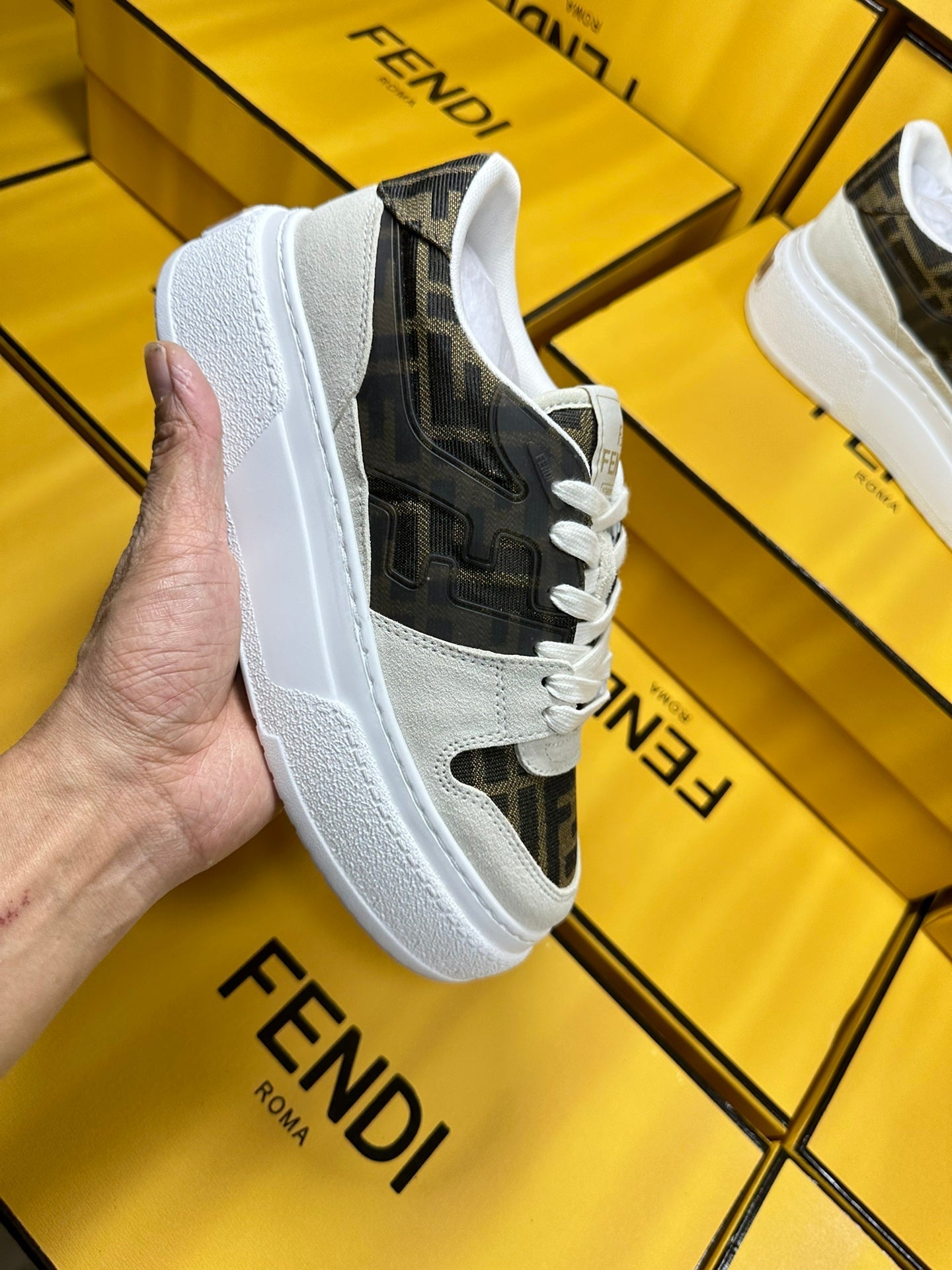 FENDI THICK-SOLDED SNEAKER IN WHITE SUEDE AND BROWN MONOGRAM FABRIC