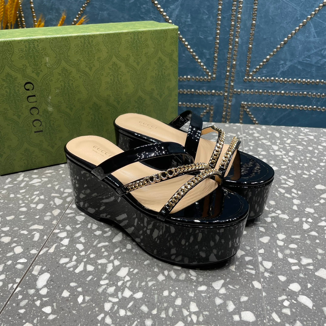 HIGH WEDGE PLATFORM IN BLACK CALFSKIN WITH GOLD HARDWARE