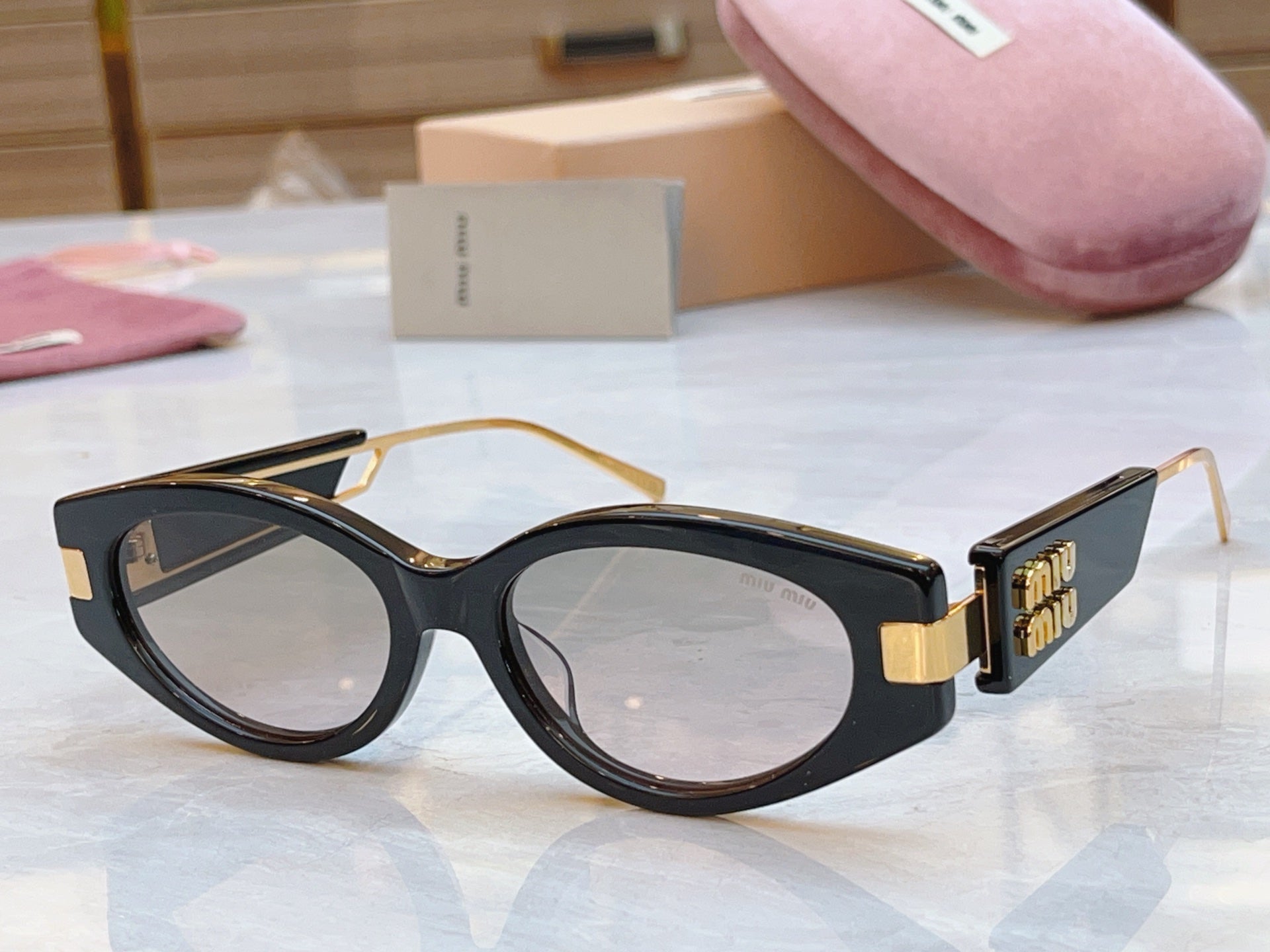 Miumiu Sunglasses 692554