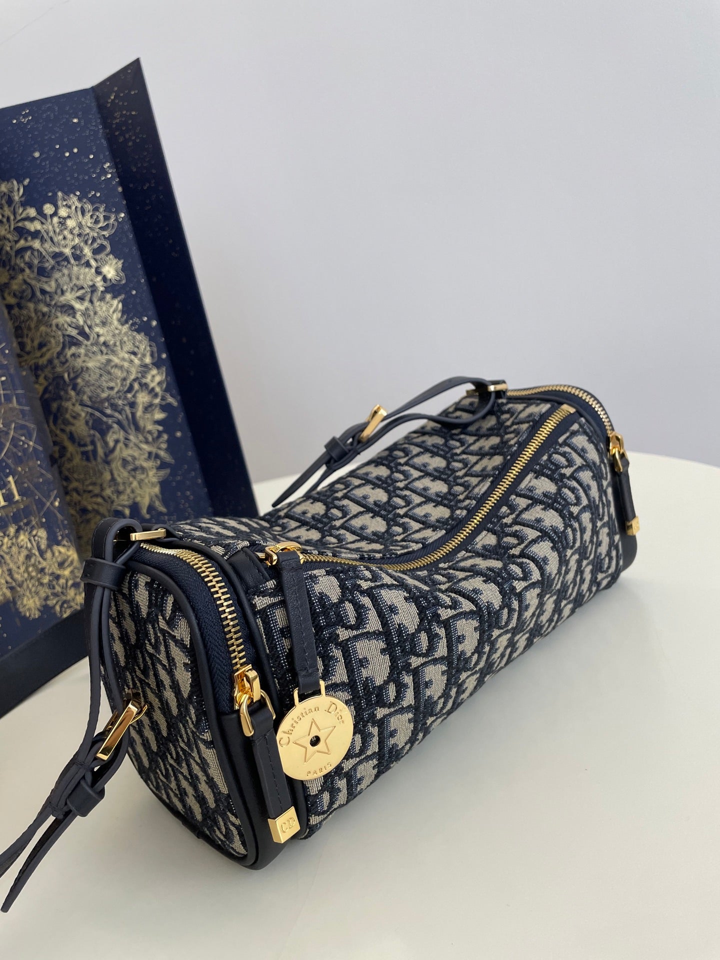 CD East-West cylindrical bag 27 blue jacquard canvas