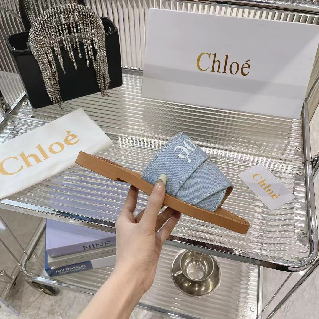 CHLOE WOODY MULE IN LIGHT BLUE DENIM WITH WHITE LOGO
