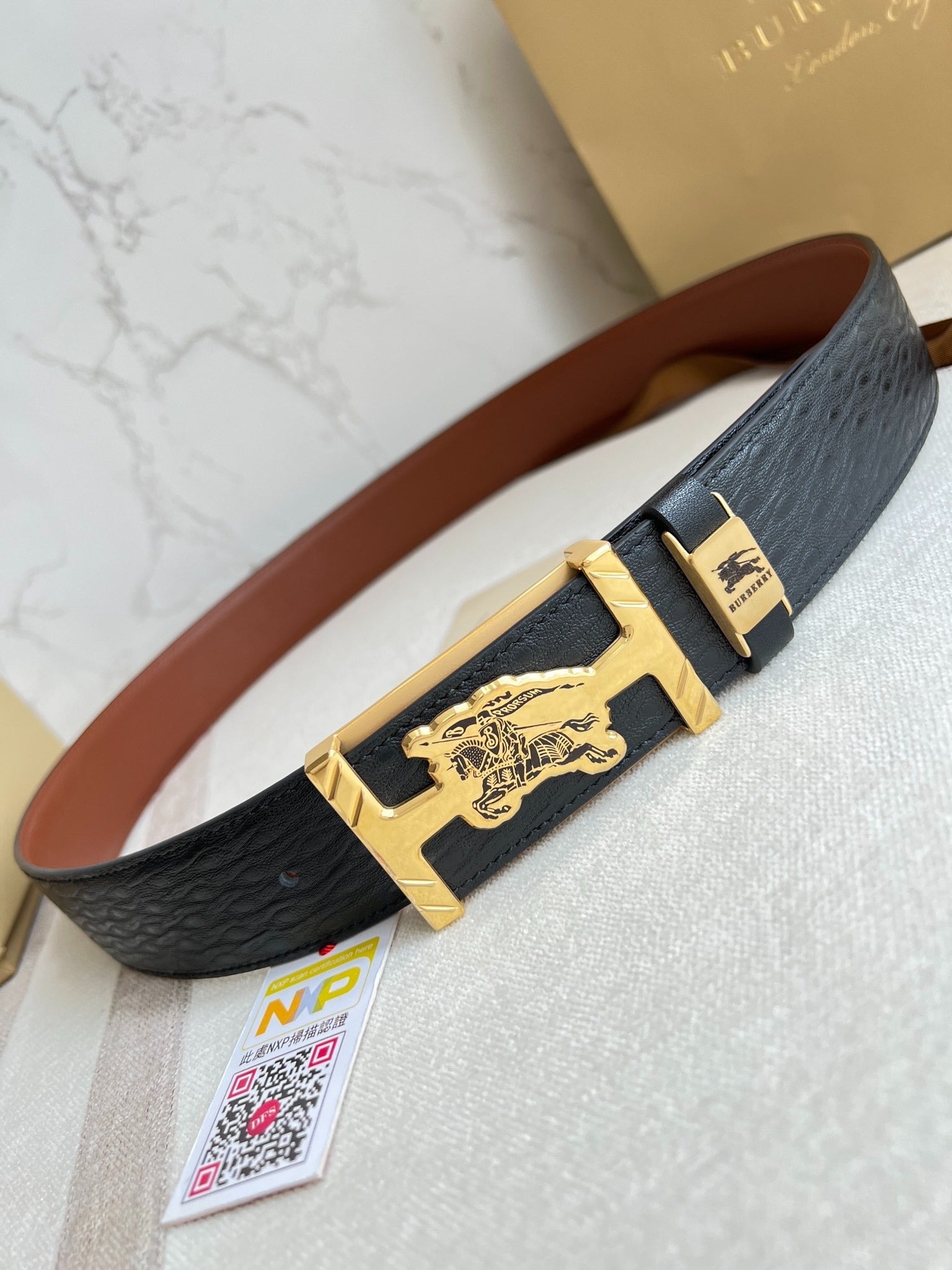 Stylish Black Leather Belt with Metallic Horse Emblem Buckle