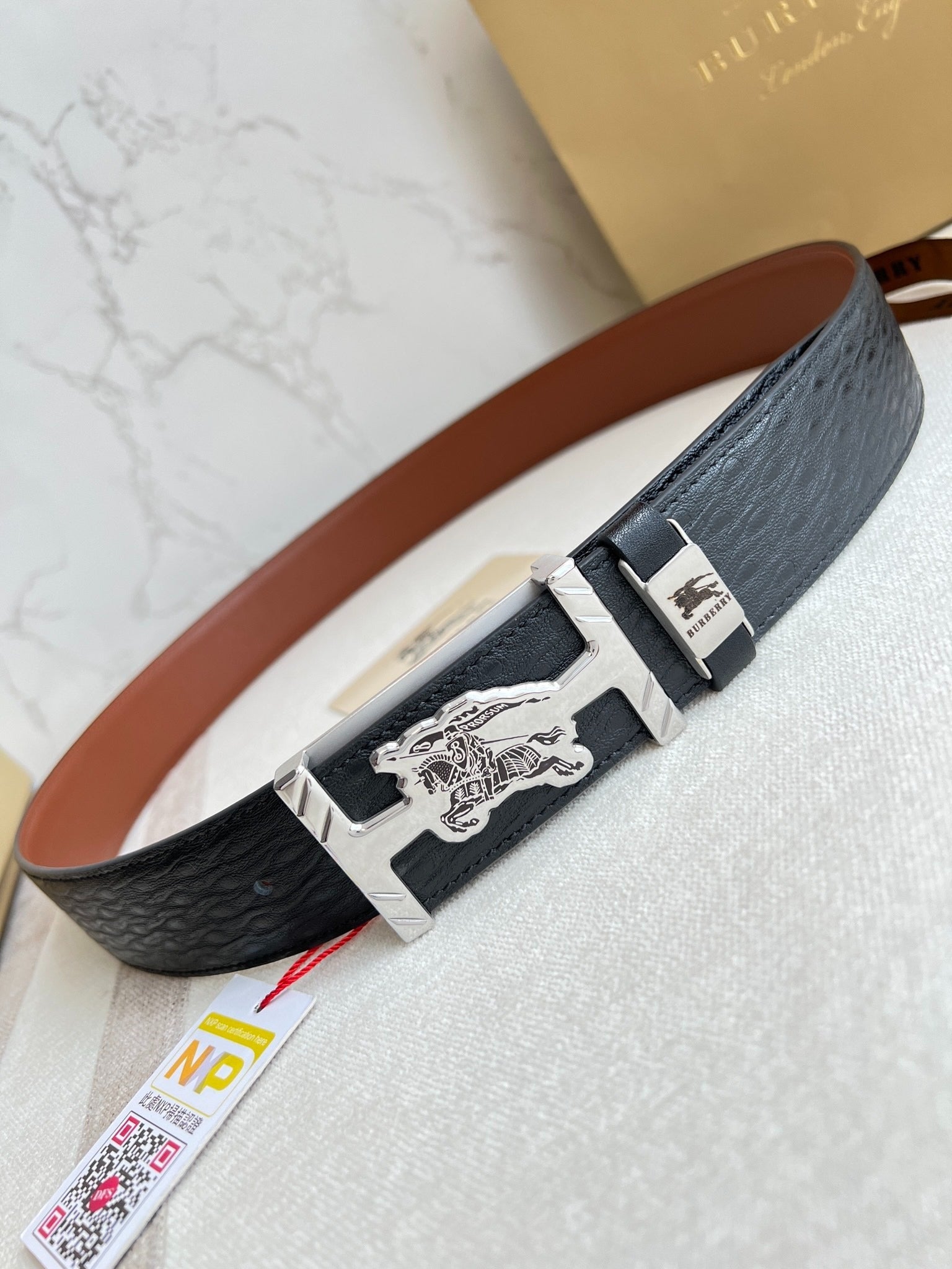 Stylish Black Leather Belt with Metallic Horse Emblem Buckle