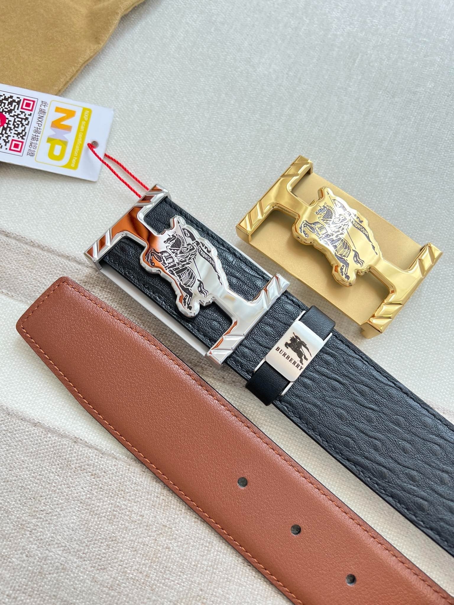 Stylish Black Leather Belt with Metallic Horse Emblem Buckle